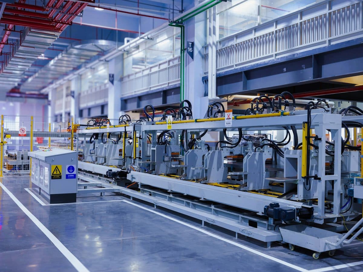 An automated assembly line running through the floor of a manufacturing plant